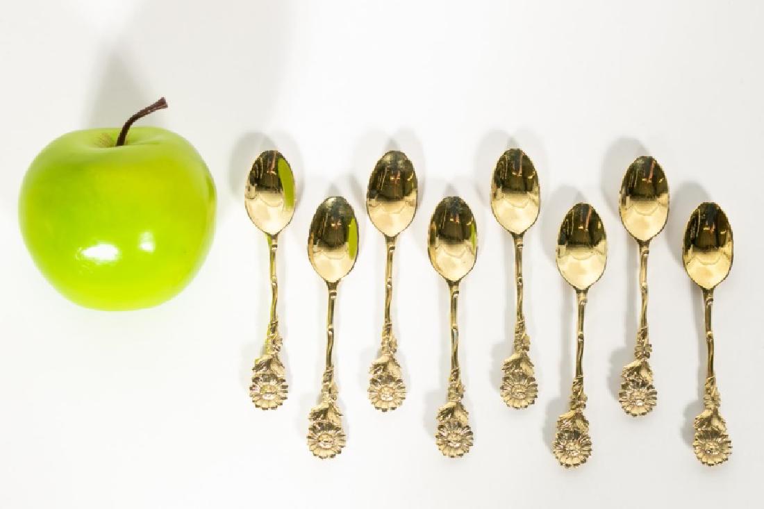 Set 8 Georgian Gilt Silver Flower Motif Tea Spoons: 18th century, English, 8 gilt sterling silver tea spoons. Unmarked, each with rococo shell bowl with naturalistic cast sunflower stem. Approx. 4.625" L, 5.475 ozt. total weight. Provenance: From the P