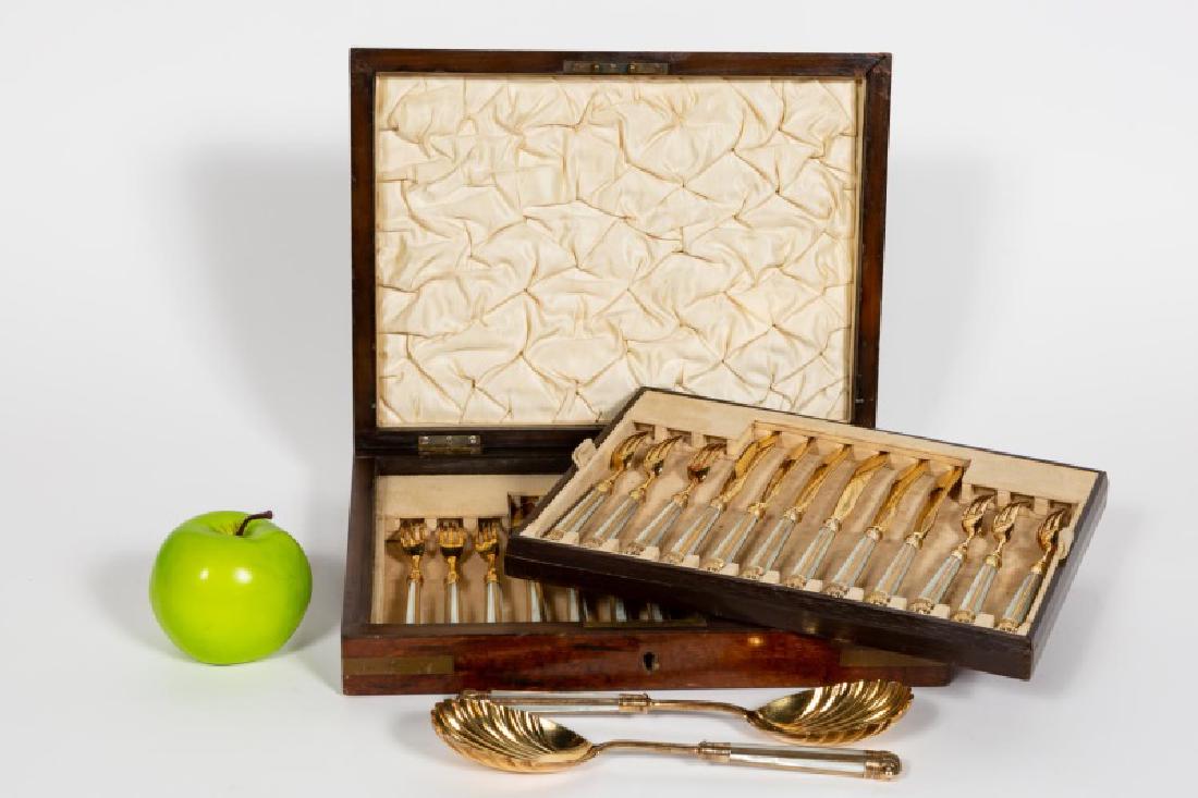 Edwardian Gilt Sterling & MOP Dessert Flatware Set: Early 20th century, English, gilt sterling silver dessert flatware set for 12. Hallmarked Sheffield, 1907, maker's mark for George Hape. Consisting of 12 forks, 12 knives and 2 shell bowl serving spoo