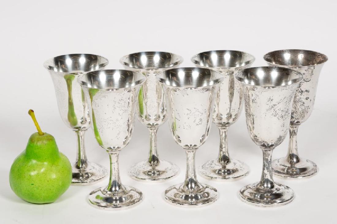 Set, Seven Wallace Sterling Silver Goblets: Wallace Silversmiths Inc.(American, founded 1835); flared bowls on a spreading stem and foot. Each goblet marked "Wallace/Sterling/122." Approx. of each d. 3.5", h. 6.625". Total weight approx. 29.63