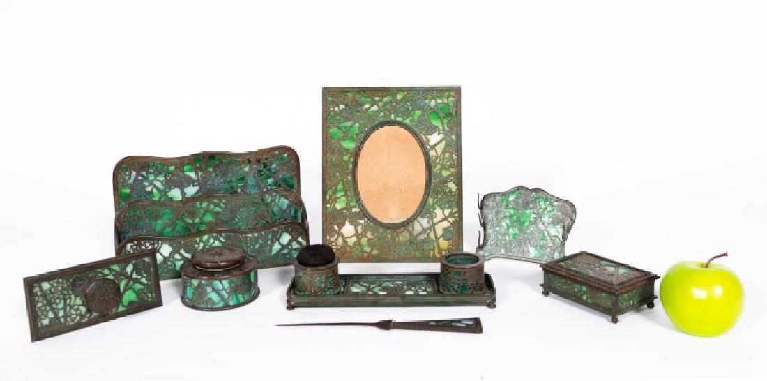 Tiffany Studios Bronze 'Grapevine' Desk Set, 8 Pc: Tiffany Studios (American, 1880-1930) 20th century. Ten pieces total; an eight piece set in the grapevine pattern including an art nouveau two tier letter holder, two pen wipes (one missing brush), pe