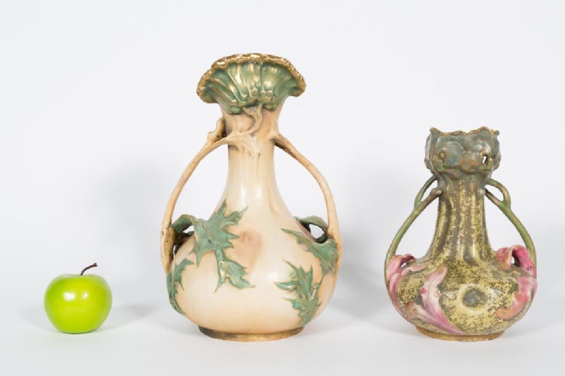 Two Amphora Art Nouveau Floriform Vases: Amphora (Austrian, founded 1892), Turn-Teplitz, Bohemia, early 20th century. A group of two pottery floriform two handles vases including one with thistle motif. Impressed mark on underside. Approx. h