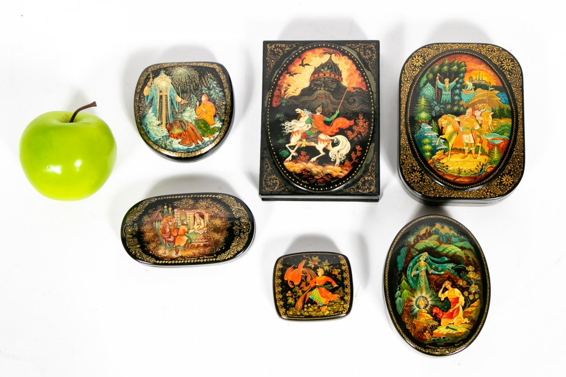 6 Russian Lacquered Boxes, Fairy Tales, Kholui: Russian, Late 20th century, Group lot of 6 hand painted and signed, Russian lacquered boxes with exceptional gold painted details. All 6 are from Kholui. Largest measures approx: 4.5" x 6" x 1.5". Pro