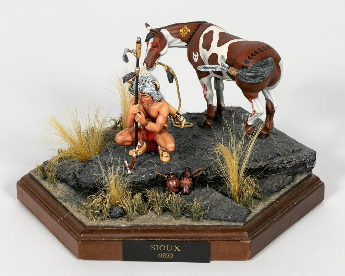David E. Kennedy, "Sioux, C. 1850" Miniature Model: David E. Kennedy (American, 20th century). A handpainted scale miniature of a "Sioux" warriorcrouched in front of his horse preparing for ahunt. Marked with a David E. Kennedy plaque to theverso. Appr