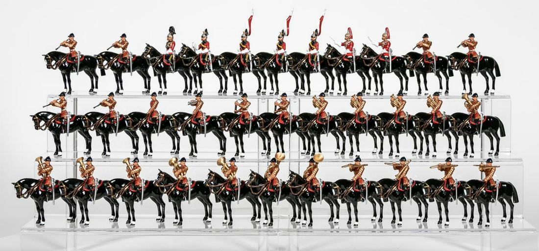33 Pc, Britains Mounted Lifeguard Band Toy Soldier: Britains (English, 20th century). A large group ofthirty three mounted lifeguard band horseman toysoldiers. Several sets combined. Marked "Britains,Made in England, 1998" to legs. Approx: h. 4.5",w. 3