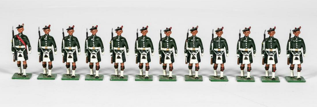 12 Pc, Signed "Irish Infantry" Toy Soldier Group: 20th century. A group of twelve Irish Infantry toysoldiers. Marked to underside illegibly. Approx:h. 2.75". Provenance: From the Estate of Charles Michael Cawley of Beverly, Massachusetts, founder of