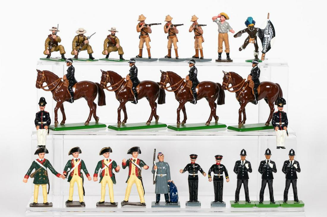 24 Pc, Grouping of Toy Soldiers: 20th century. A twenty four piece grouping of toysoldiers by various makers including TrophyMiniatures, Britains and others. Approx: h. 2.5". Provenance: From the Estate of Charles Michael Cawley of B