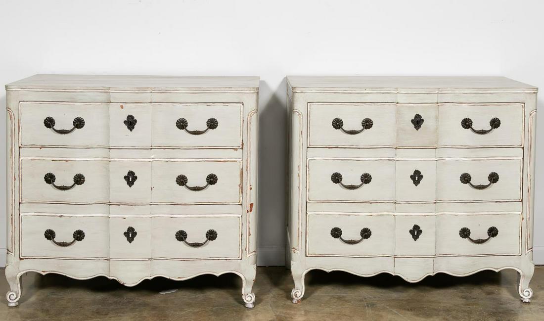 Pair, John Widdicomb Blue-Grey Painted Chests: John Widdicomb (American, 1897-2002), mid-20th century. Pair of painted wooden chests in the French provincial Louis XV taste having three serpentine drawers and rising on whorl feet. Marked to the up