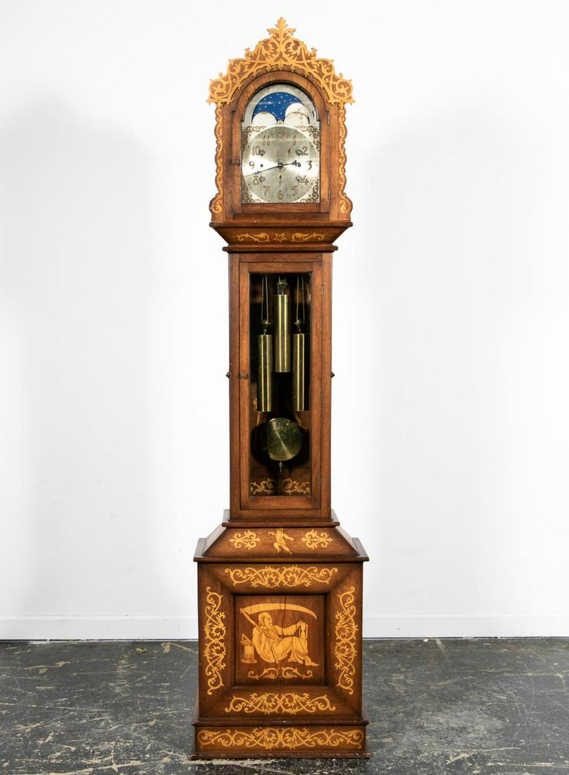Allegorical Inlaid Mahogany Tall Case Clock, 1903: Seth Thomas Clock Company movement(American, founded 1853). Mahogany longcase or grandfather clock with elaborate figural and scroll inlay, having a scrolled crest pediment male pipers on the side of
