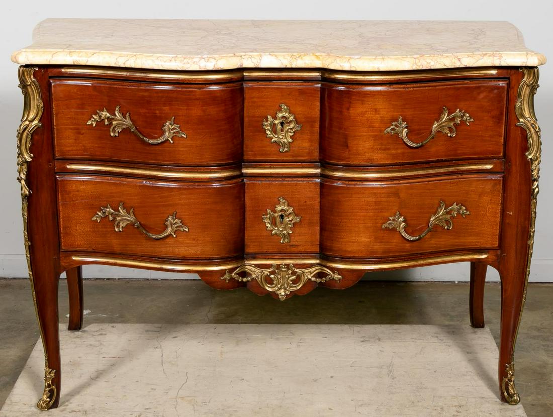 19th C. Marble Top Rococo Two Drawer Commode: Continental, 19th century or older. Bronze mounted cherry chest having cupid's bow form drawers with foliate patterned hardware, conforming marble top and rising on front cabriole legs with sabots. Un