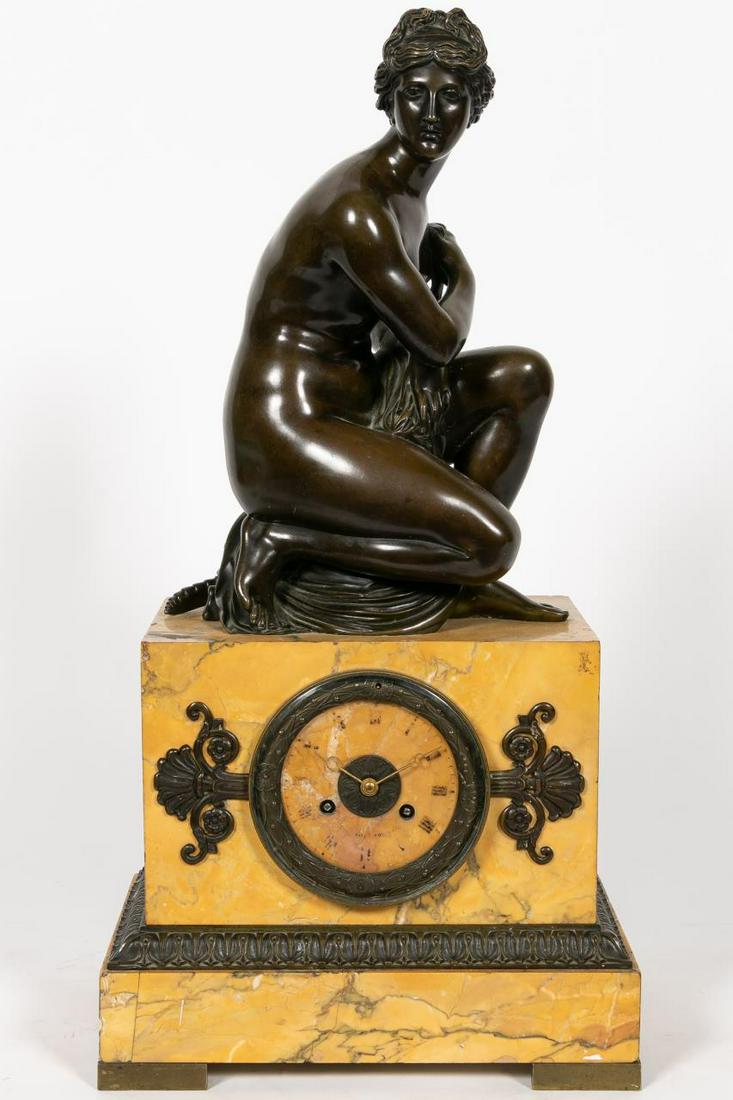 C. 1830, French Bronze and Sienna Marble Clock: French, circa 1830. Charles X or Louis Philippe era in the Neoclassical/Empire taste, having a figure patinated bronze figure of the crouching "Venus a La Tortue" after Antoine Coysevox (French, 1640-