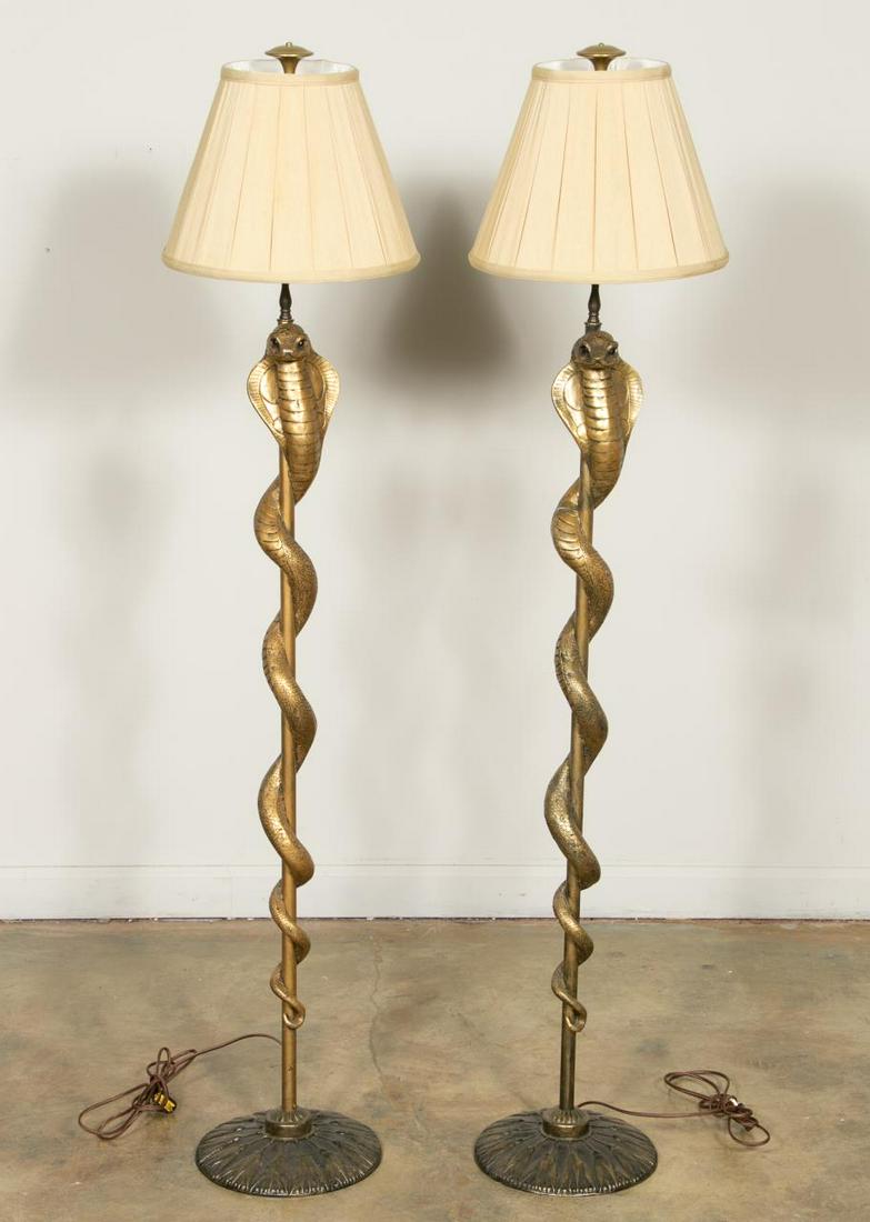 Pair, Art Deco Style Cobra Floor Lamps: 20th century. Pair of cast metal and resin Art Deco style single light floor lamps in the manner of Jean Dunand (Swiss-French, 1877Â–1942) having a gold finished, each with a twisted snake around a