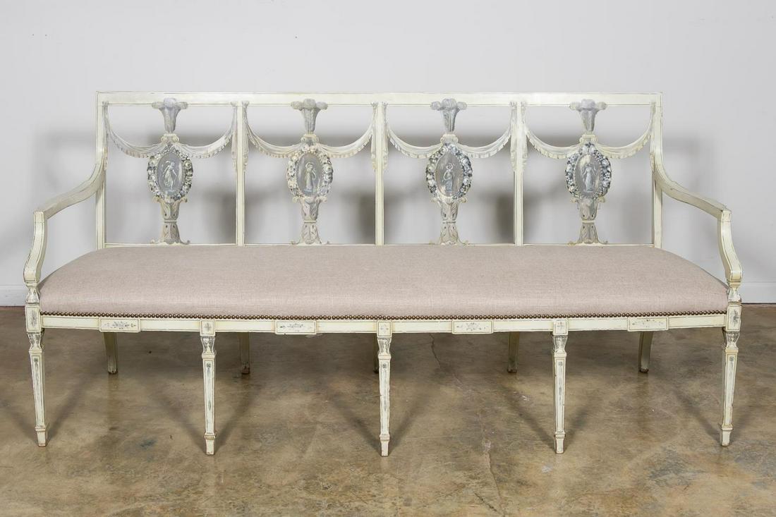 20th C. English Painted Adams Style Settee: English, 20th century. En grisaille painted wooden bench in the neoclassical taste having a square back with splats decorated with classical maidens, swags and Prince of Wales feathers, curved arms an