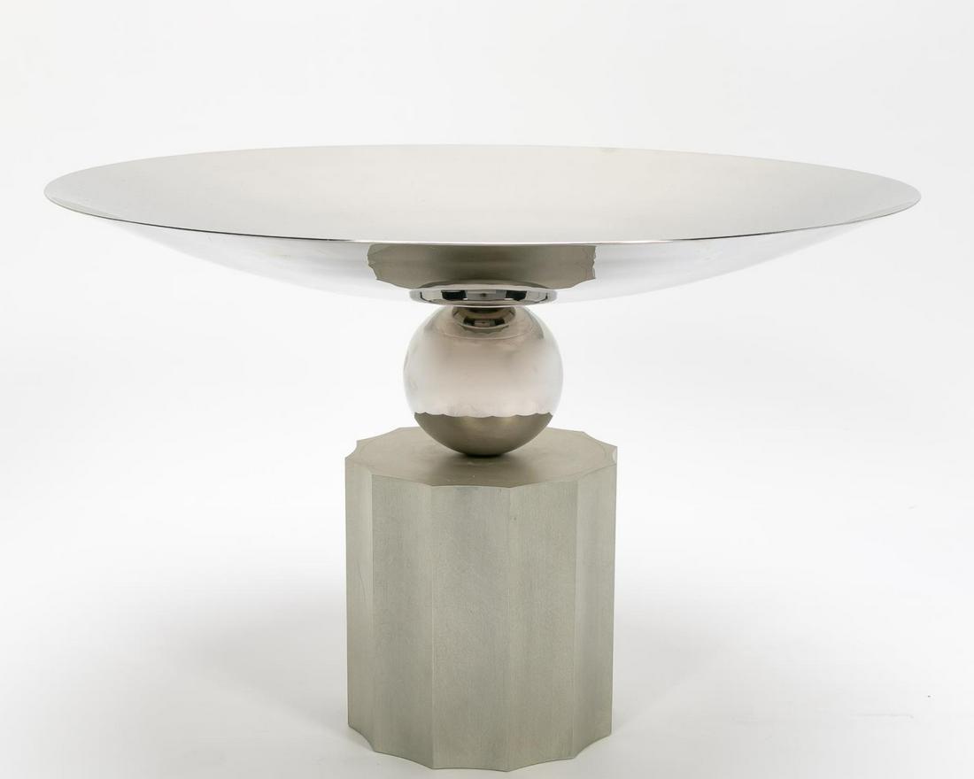 Breuton Modern Chrome "Empire" Bowl: Brueton (American, founded 1926), early 21st century. Large polished tapered stainless steel bowl, having a spherical stem and resting on an acid washed aluminum fluted base, "Empire," designed by Sta