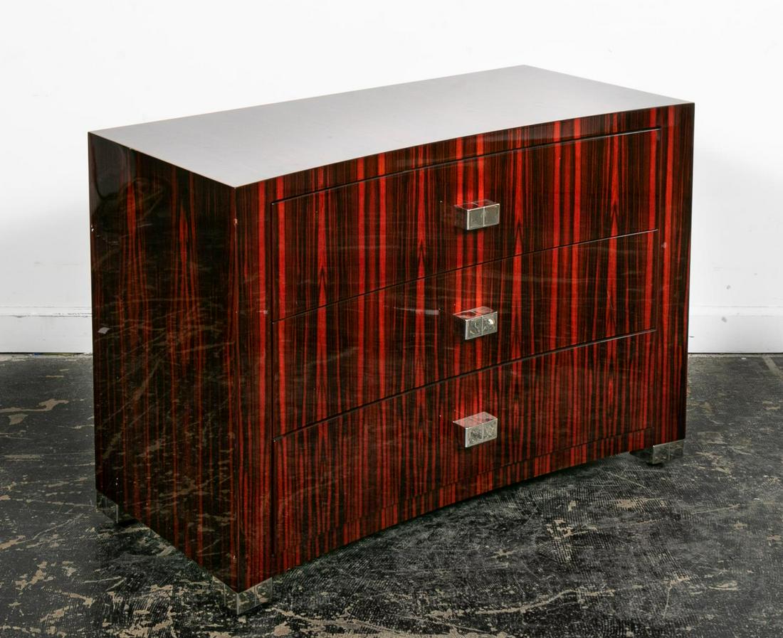 Breuton "Madison Avenue" Chest of Drawers: Stanley Jay Freidman for Brueton Furniture (American, est. 20th century), 21st century. A Madison Ave concave chest of drawers with high lacquer finish in macassar ebony. Approx. h 29.5", w. 42", d. 1