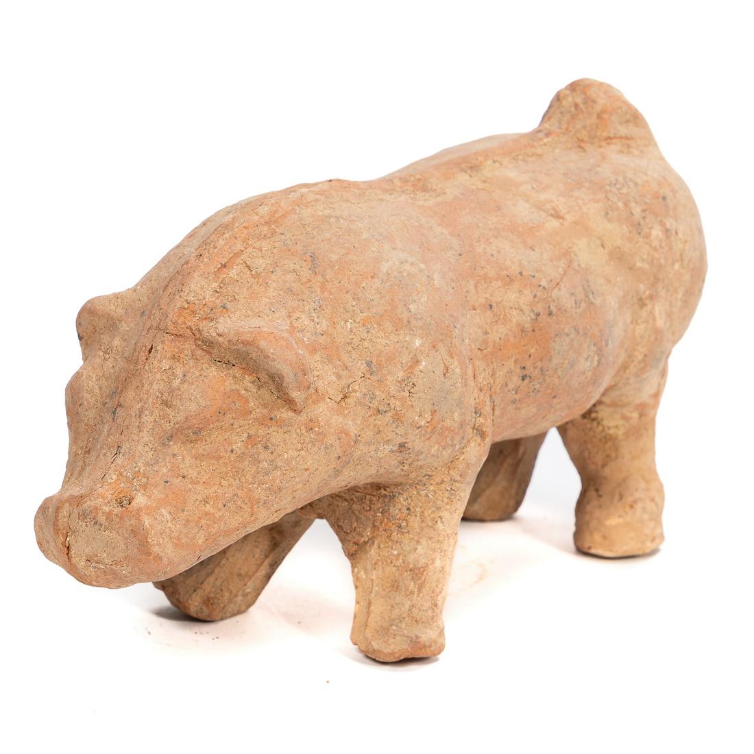 Chinese Eastern Han Dynasty Terracotta Pig: Chinese, Han Dynasty. The unglazed earthenware pig standing with head turned to one side and tail curled up on the other. Modeled in buff colored ceramic. Approx: h. 6.5" w. 11.5" d. 4.5". Provenance: