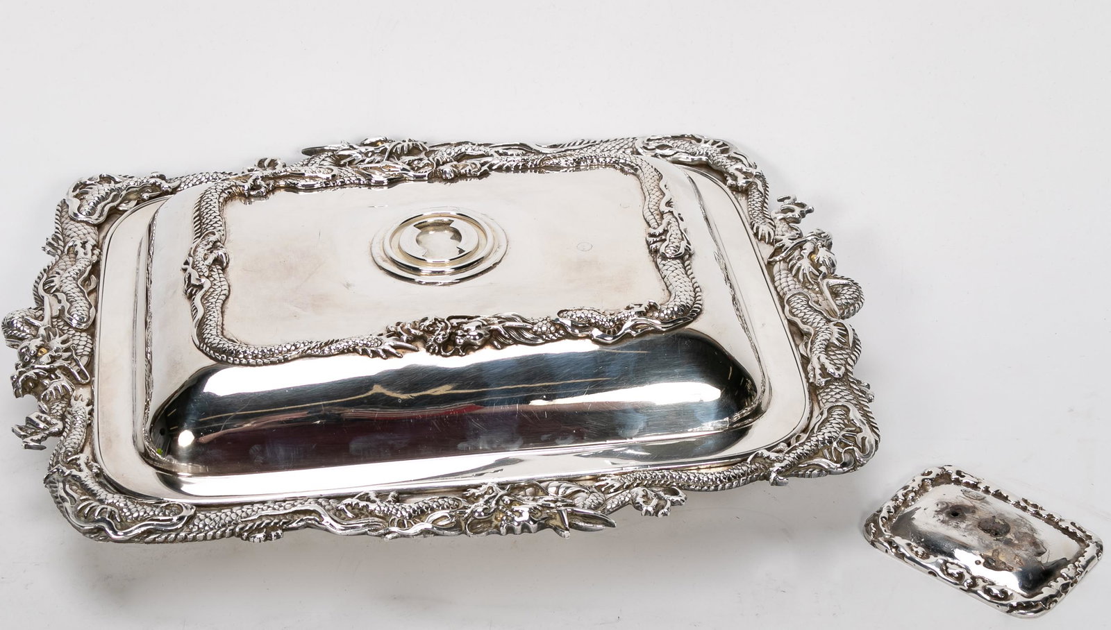 Japanese Meiji Period .999 Silver Lidded Vegetable: Japanese, 1868-1912. Meiji era export covered .999 silver covered vegetable or entree server decorated with will modeled scrolling dragons with gilded eyes. Inscribed "Biyaseki/Beautiful House Shop", 