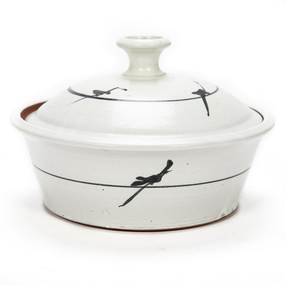 Rick Berman Covered White Glaze Casserole Dish: Rick Berman (Amercan/Atlanta, 20/21st century). A white glaze hand thrown stoneware covered casserole dish with black brushwork to the surface of lid and side walls. Signed to underside. Approx: h. 6.