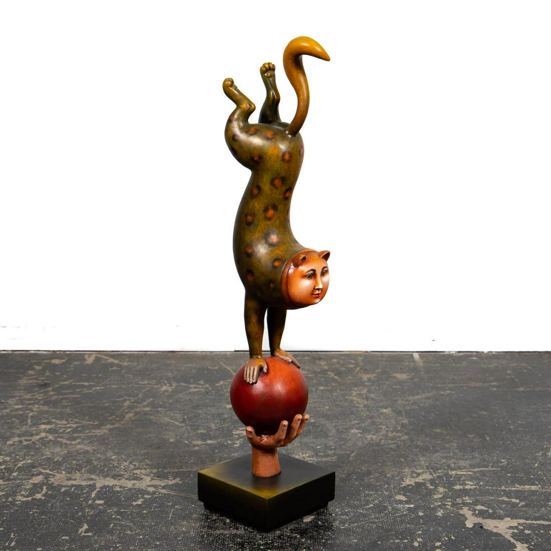 Bustamante "Equilibrist Ball In Hand" Sculpture: Sergio Bustamante (Mexican, born 1949). "Equilibrist Ball In Hand", hand-painted resin sculpture, signed to ball "Sergio Bustamante, 13/150". Approx: h. 43.5", w. 9.25", d. 11". Provenance: From The E