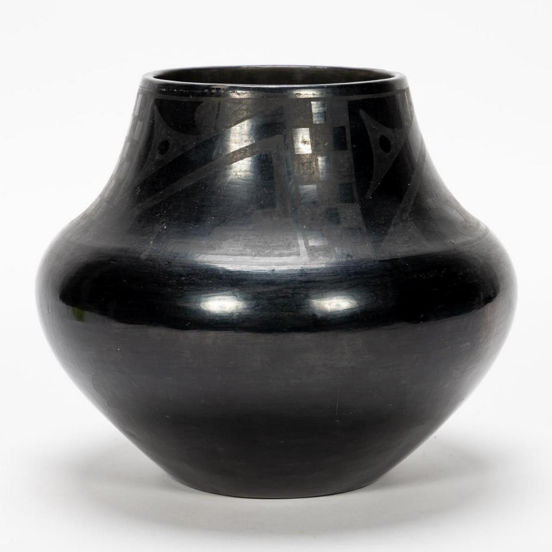 Maria Martinez Santa Clara Large Blackware Pot: Maria Martinez (American, 1887-1980), 20th century. A wide shoulder Santa Clara black ware pot. Signed on underside "Maria". Approx. h. 9.25, w. 9.5".