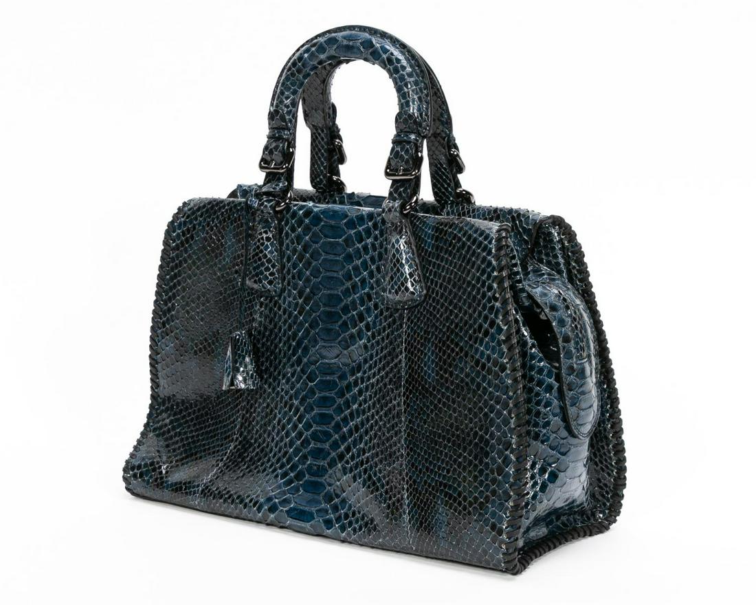 Giorgio Armani Blue Python Satchel Bag W/ Dust Bag: Giorgio Armani (Italian, founded 1975). A blue python handbag with black tone metallic hardware, two python coated handles and a zip closure; the interior is lined is beige suede, two slip pockets and