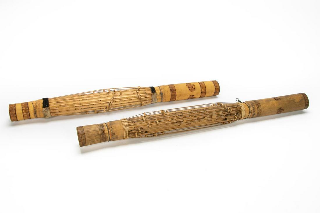 Two 20th Century, Malagasy Valihas Bamboo Zithers: Malagasy, 20th century. Pair of bamboo zithers or valihas having figural and tribal pyrographic decoration, one with hide bands. Unmarked. Approx. of one, length 34.5".