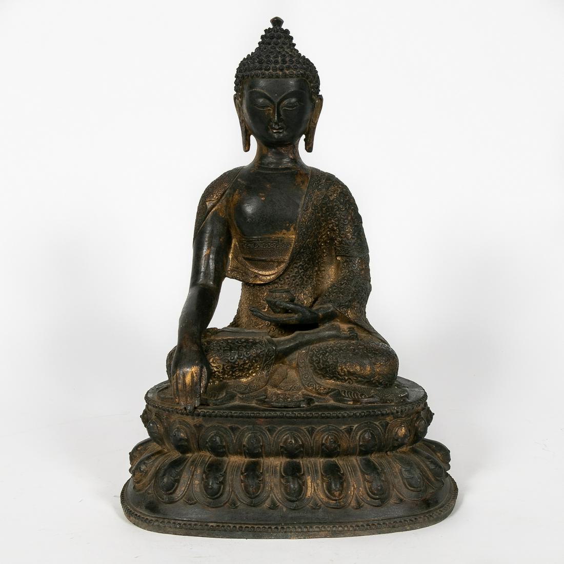Chinese Qing Style Bronze Partial Gilt Buddha: Chinese. Cast bronze Qing style figure of a seated Buddha holding a begging bowl on a throne with buddhist iconography. Unmarked. Approx. h. 17.5", w. 12", d. 9".