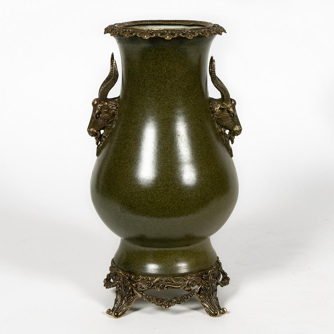 Chinese Tea Dust Ormolu Mounted Vase: Chinese. Green matte glazed porcelain bulbous vase having foliate and goat head mounted bronze mounts. Kangxi style mark to underside, red wax export seal and Ray Manhattans Collection and Schonburg-J