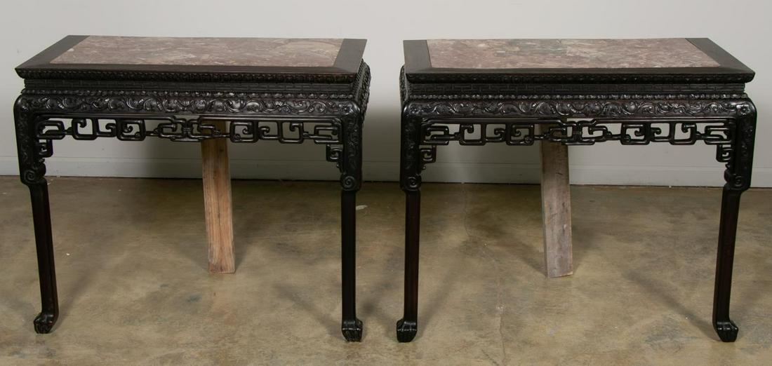 Pair, Chinese Carved Hardwood Marble Console Table: Chinese. A pair of carved hardwood and rouge marble console tables with meander motif apron. Approx. h. 32”, w. 38”, d. 19”.