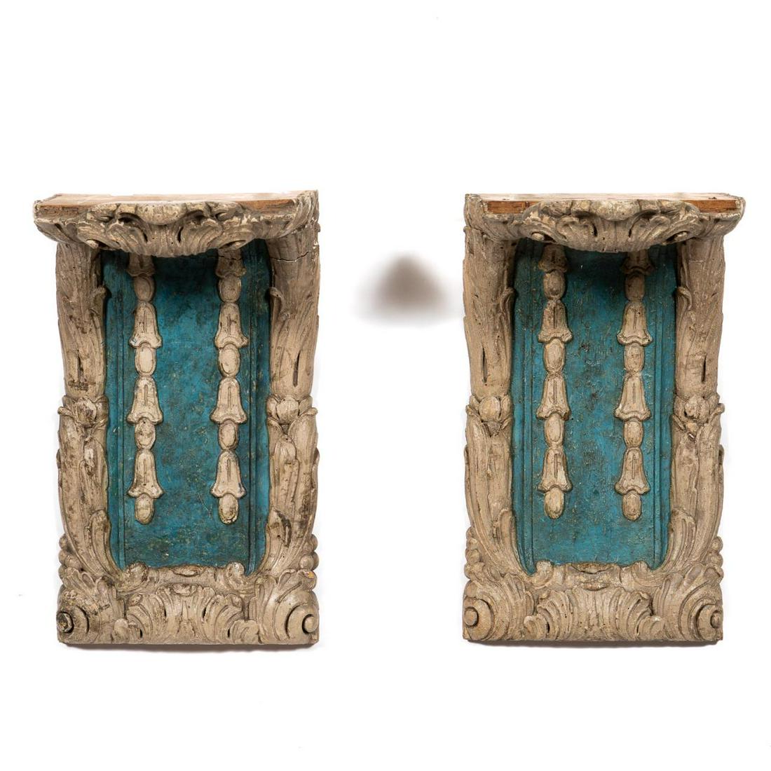 Pair, 19th C. French Baroque Style Wall Brackets: French. 19th century. Carved wooden cream and blue wall brackets in the baroque taste having a foliate border with bell flower detail. Unmarked. Approx. h. 16", w. 9.25", d. 12". Provenance: From The 