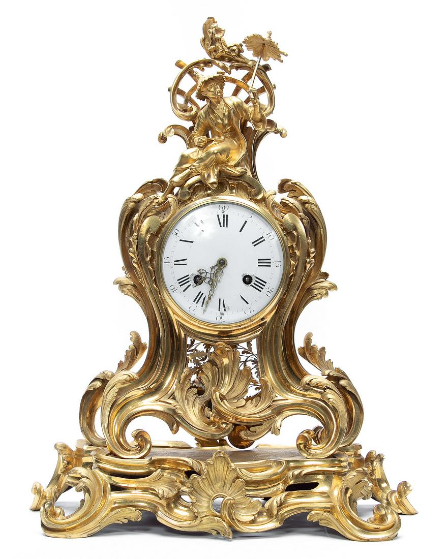 18th Century Louis XV Ormolu Chinoiserie Clock: France, mid-18th century. Louis XV ormolu bronze mantel clock. Rococo style case with scrolling acanthus leaves and finely cut foliate grillwork having a chinoiserie figural crest and mounted to a mat