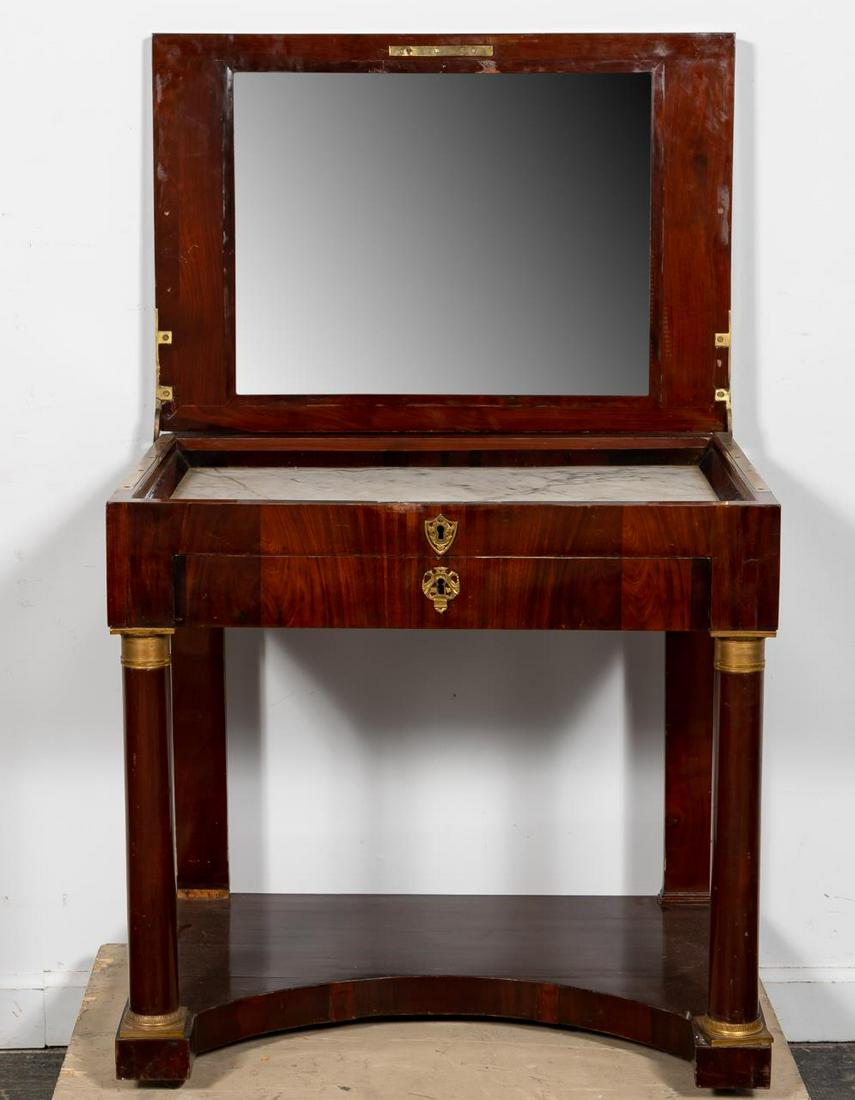 19th C. Empire Style Mahogany & Ormolu Coiffeuse: French, 19th century. Mahogany and ormolu mounted coiffeuse or dressing table in the empire taste having a flip-top that opens to reveal a mirror and white marble surface, single drawer and rising on 