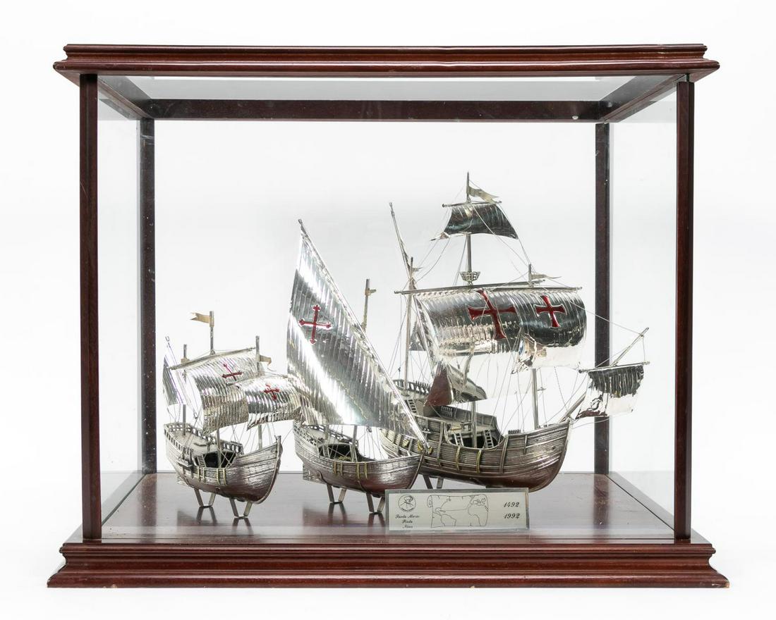 Cased Italian Sterling Silver Columbus Ship Models: Italian, mid to late 20th century. Exceptional grouping of Christopher Columbus's three ships, the Nina, the Pinta and the Santa Maria cast in sterling silver with intricate details down to the wooden