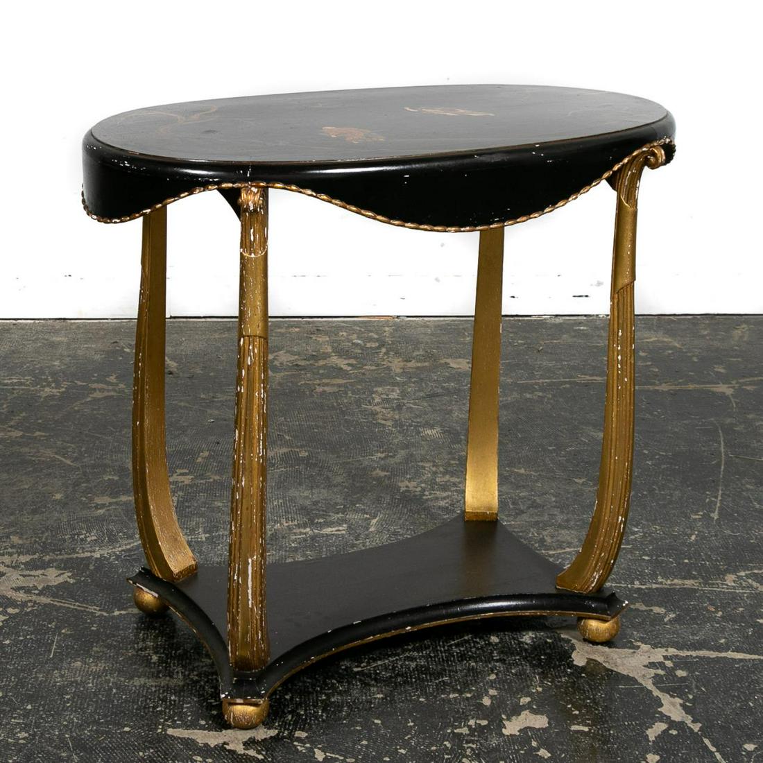 Continental Black & Gilt Oval Japanned Table: Continental, mid-20th century. Oval chinoiserie decorated table in the manner of Maison Jansen (French, founded 1880), having a figural warrior scene top, draped beaded sides, fluted scrolled legs res