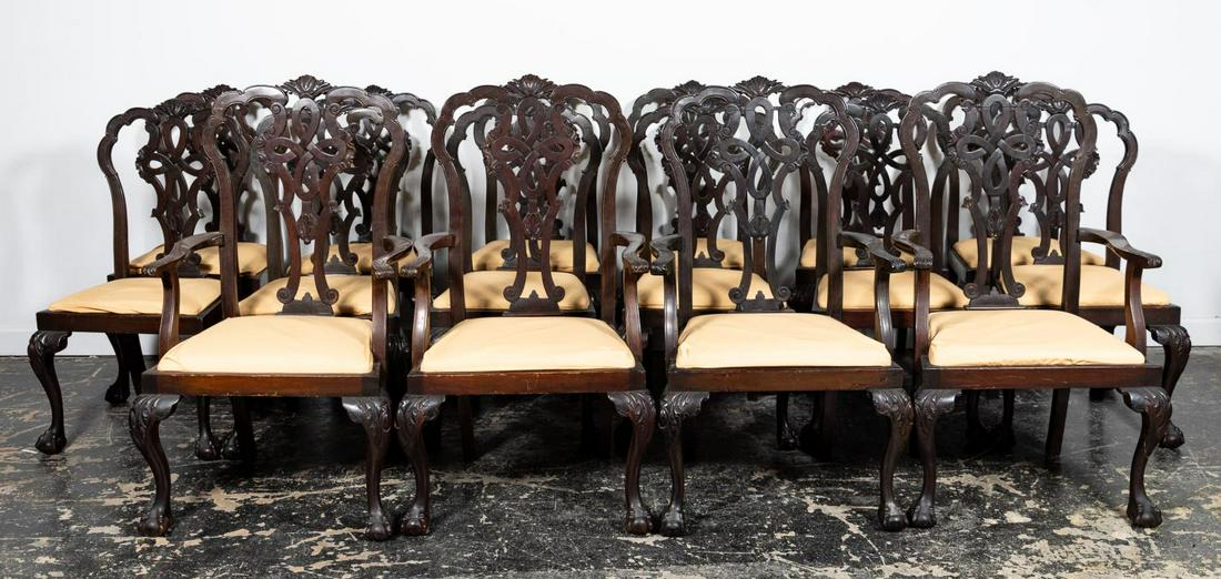 Set, 16 English Chippendale Style Dining Chairs: English, early 20th century. Set of sixteen Edwardian era mahogany dining chairs in the Georgian-Chippendale taste, comprising four arm and twelve side chairs having shaped crests, pierced and knotted