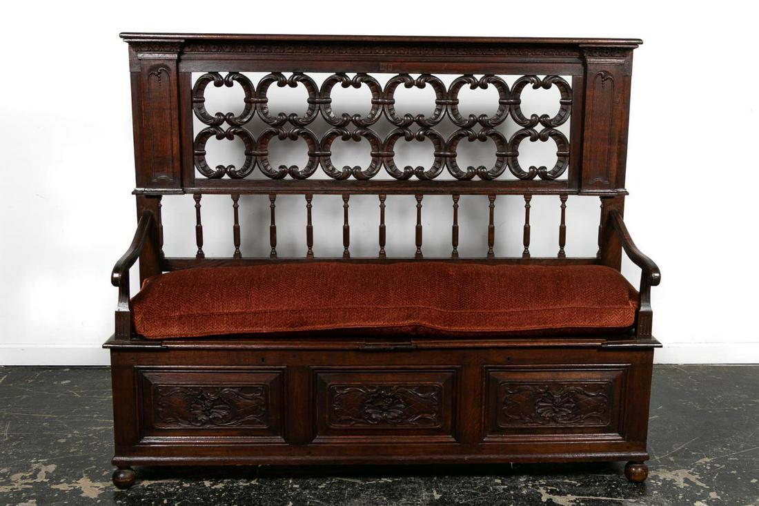 19th C. Italian Baroque Revival Walnut Hall Settle: Italian or Continental, 19th century. Large well carved high-back walnut hall settle or bench in the Italian baroque taste having a shaped cornice with an open scrolled panel with spindles below, scro