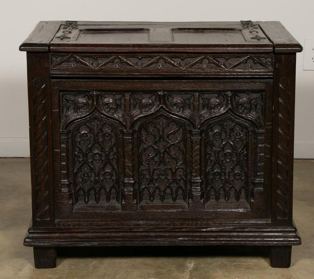 19th C. English Gothic Revival Oak Coffer or Chest: English, 19th century. Carved oak chest or coffer in the Gothic revival taste having a hinged lid with iron hinges, front panel decorated with tracery and side panel with linen fold carving. Unmarked.