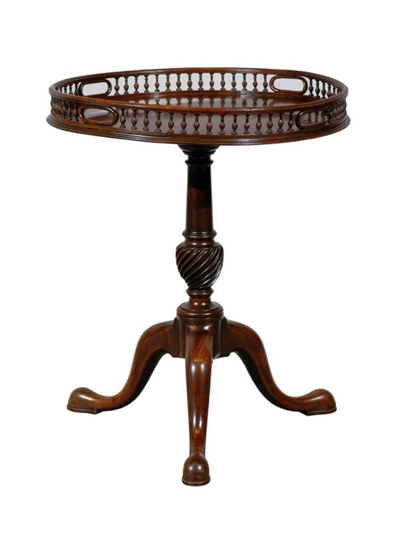 19th Century, English Tripod Table w/ Gallery Rail: English, 19th century. A mahogany tripod table with carved wood gallery and pad feet. Approx. h. 29.25" (top of gallery), diameter of top 24"