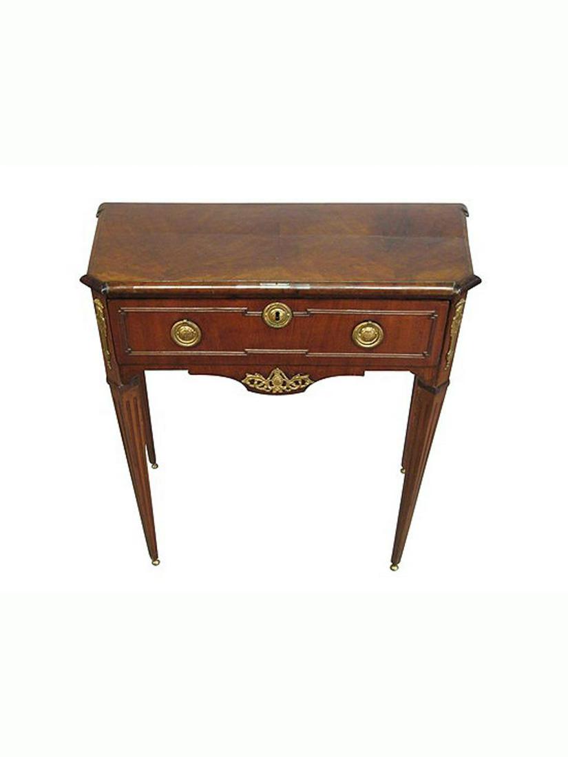 Early 19th C. Dutch Mahogany Side Table: Dutch, early 19th century. A mahogany one drawer side table with brass accents and canted corners. Approx. h. 28.5", w. 30", d. 15.25"