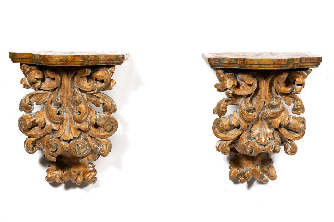 Pair, 19th C. Baroque Style Carved Wall Brackets: Likely Continental, 19th century. Pair of wooden and gesso wall brackets in the baroque taste having a scrolled acanthus form and faux ochre marble painted finish. Unmarked. Approx. of one, h. 18.5", 