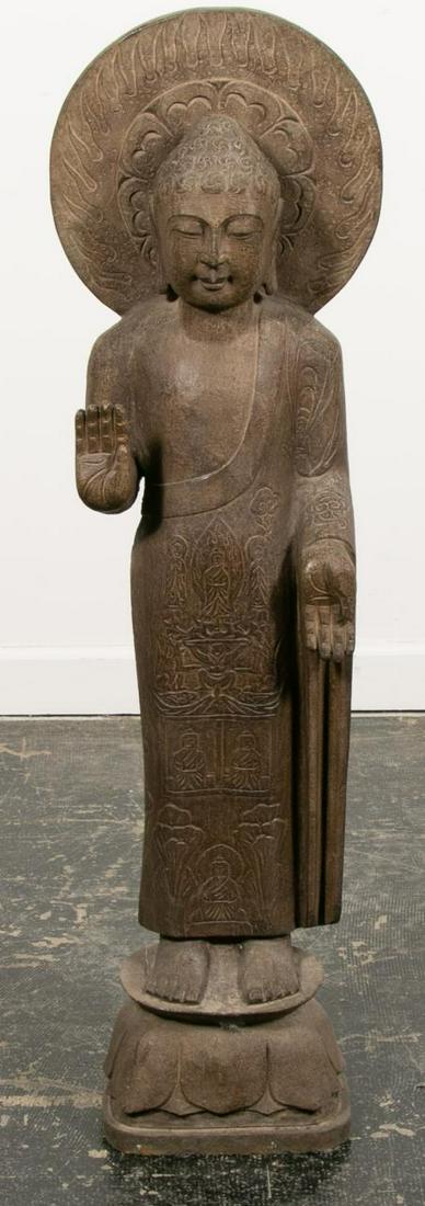 CHINESE STANDING BUDDHA STONE GARDEN FIGURE: Chinese, 20th century. A stone garden or entryway standing Buddhist Lohan. Apparently unmarked. Approx. h. 47", w. (at widest) 13.25", d. 6.75"