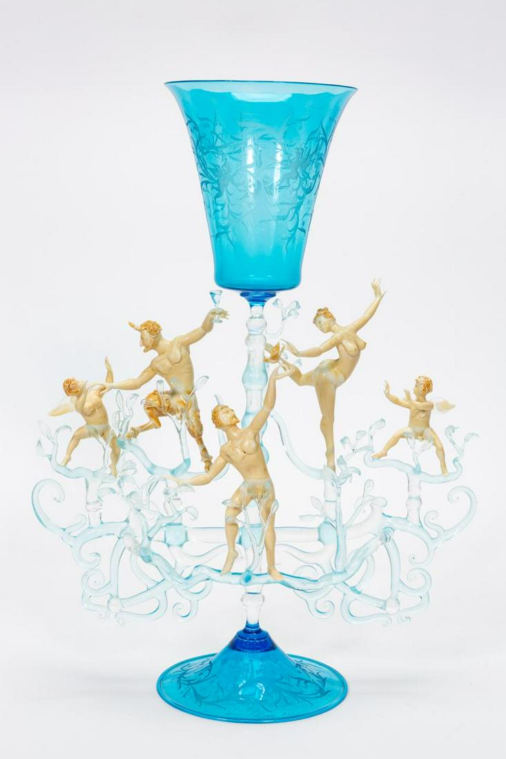 LUCIO BUBACCO "CHEERS" INTAGLIO EROTIC ART GLASS: Lucio Bubacco (Italian, born 1957), 2001. A large Murano erotic art glass sculpture with five nude figures across a branched central stem with an intaglio cut foliate and cherub design to the aquamari