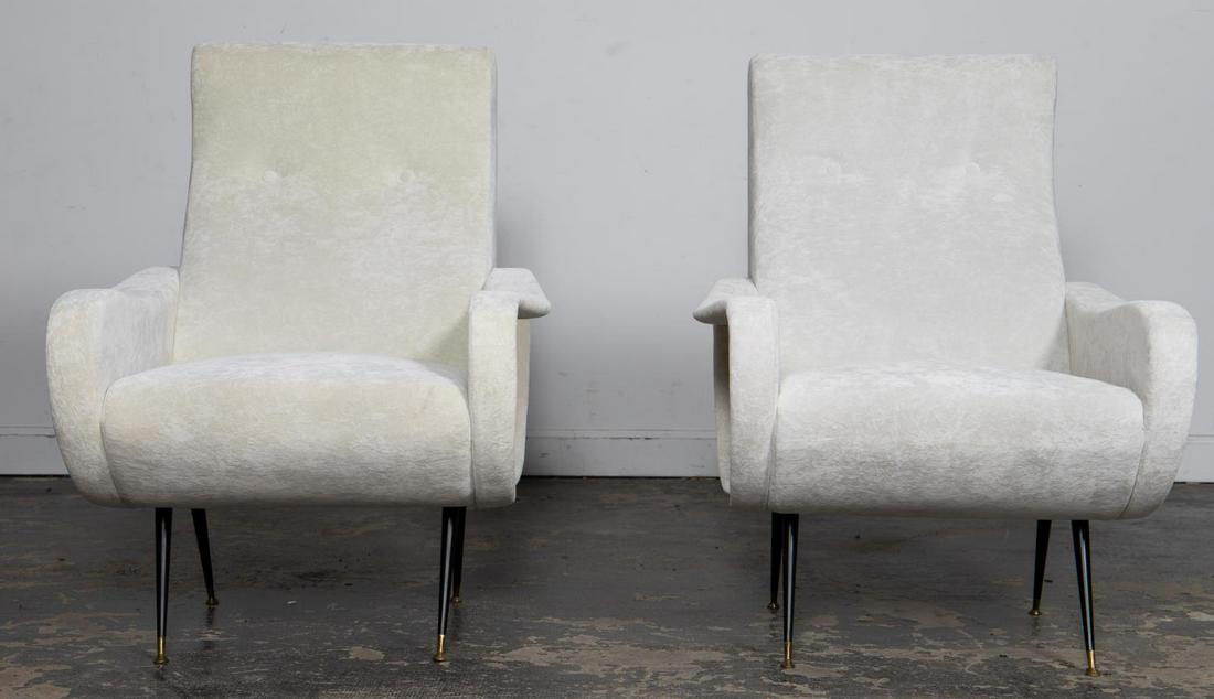 PAIR, MARCO ZANUSO STYLE "LADY" LOUNGE CHAIRS: In the style of Marco Zanuso (Italian, 1916-2001) for Arflex (Italian, founded 1947). A pair of Mid-Century Modern "Lady" lounge chairs with black and brass capped legs and off white upholstery. Appar