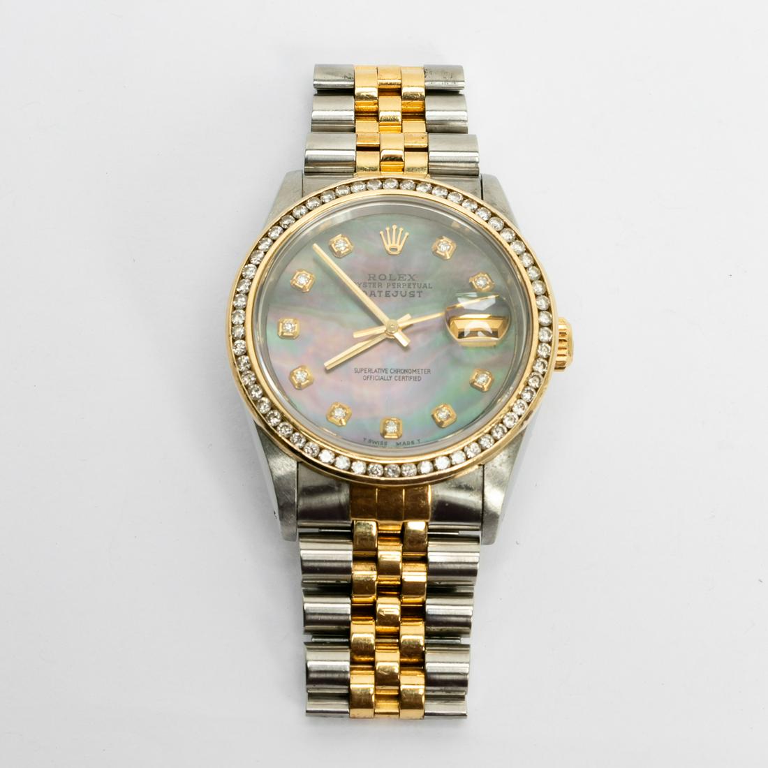 ROLEX OYSTER PERPETUAL DATE MOP DIAMOND WATCH: Rolex (Swiss, founded 1905), 1980's. An 18k yellow gold & stainless steel Oyster Perpetual Datejust wrist watch, model number 16233, with mother of pearl dial and diamond bezel - approx. 1.0 carat tot