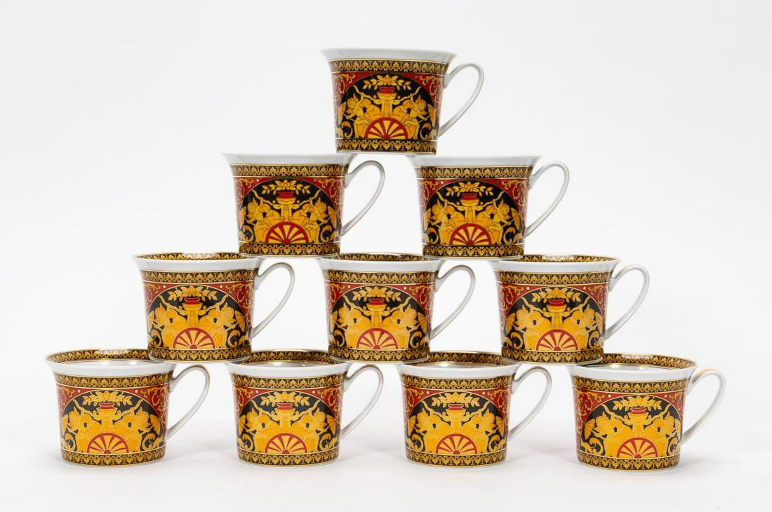 SET, 10 VERSACE MEETS ROSENTHAL BREAKFAST CUPS: Versace (Italian, founded 1978), Rosenthal (German, founded 1879), late 20th century. Set of ten Versace Meets Rosenthal gilded "Ikarus Medusa" or "Medusa" (introduced 1994) porcelain breakfast cups h