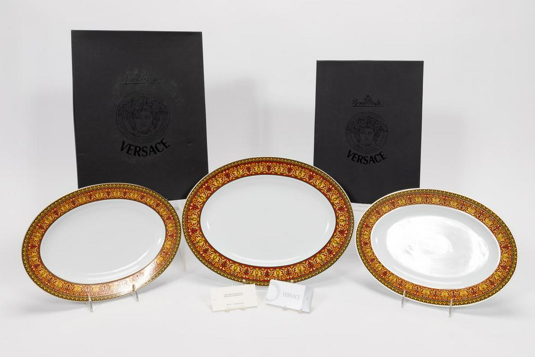 3PC., VERSACE MEETS ROSENTHAL PORCELAIN PLATTERS: Versace (Italian, founded 1978), Rosenthal (German, founded 1879), late 20th century. Set of three gilded Versace Meets Rosenthal "Ikarus Medusa" or "Medusa" (introduced 1994) porcelain oval platters