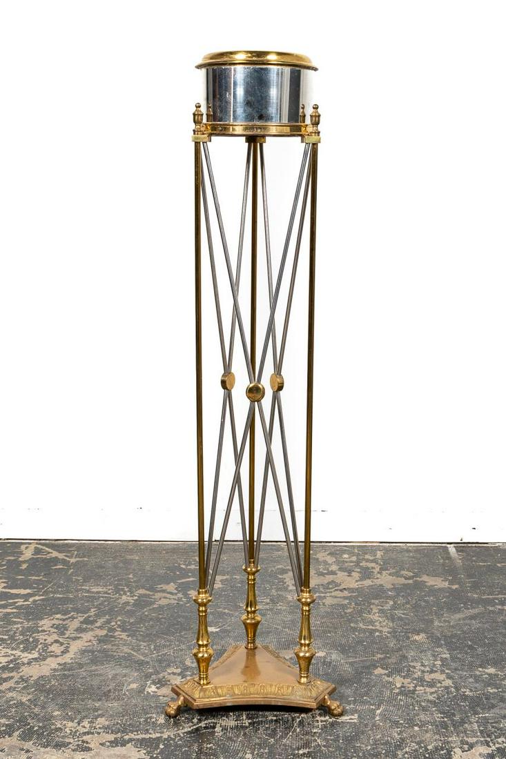 MID-20TH C. MANNER OF MAISON JANSEN JARDINIERE: Manner of Maison Jansen (French, founded 1880), mid-20th century. Italian crafted polished steel and brass jardiniere or planter on stand in the neoclassical taste having a circular pot, legs with X-f