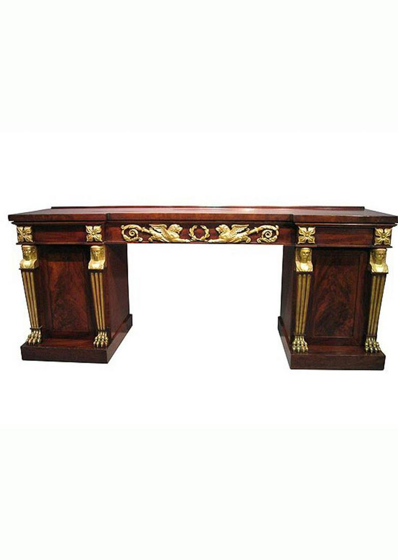 19TH C FRENCH EGYPTIAN REVIVAL MAHOGANY SERVER: French, 19th century. An Egyptian revival mahogany server with gilt accented empire designs. Also with breakfront style outline. Approx. h. 37", w. 92.5", d. 28"