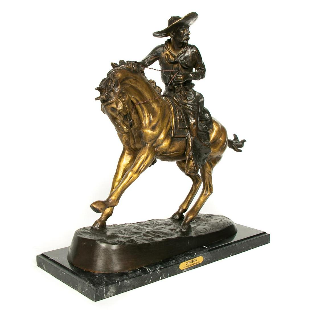 AFTER FREDERIC REMINGTON "COWBOY" BRONZE SCULPTURE: After Frederic Remington (American, 1861-1909). "Cowboy", partial gilt cast bronze with marble base, signed to base "Frederic Remington". Approx: h. 22", w. 25", d. 10". Provenance: From the Private C