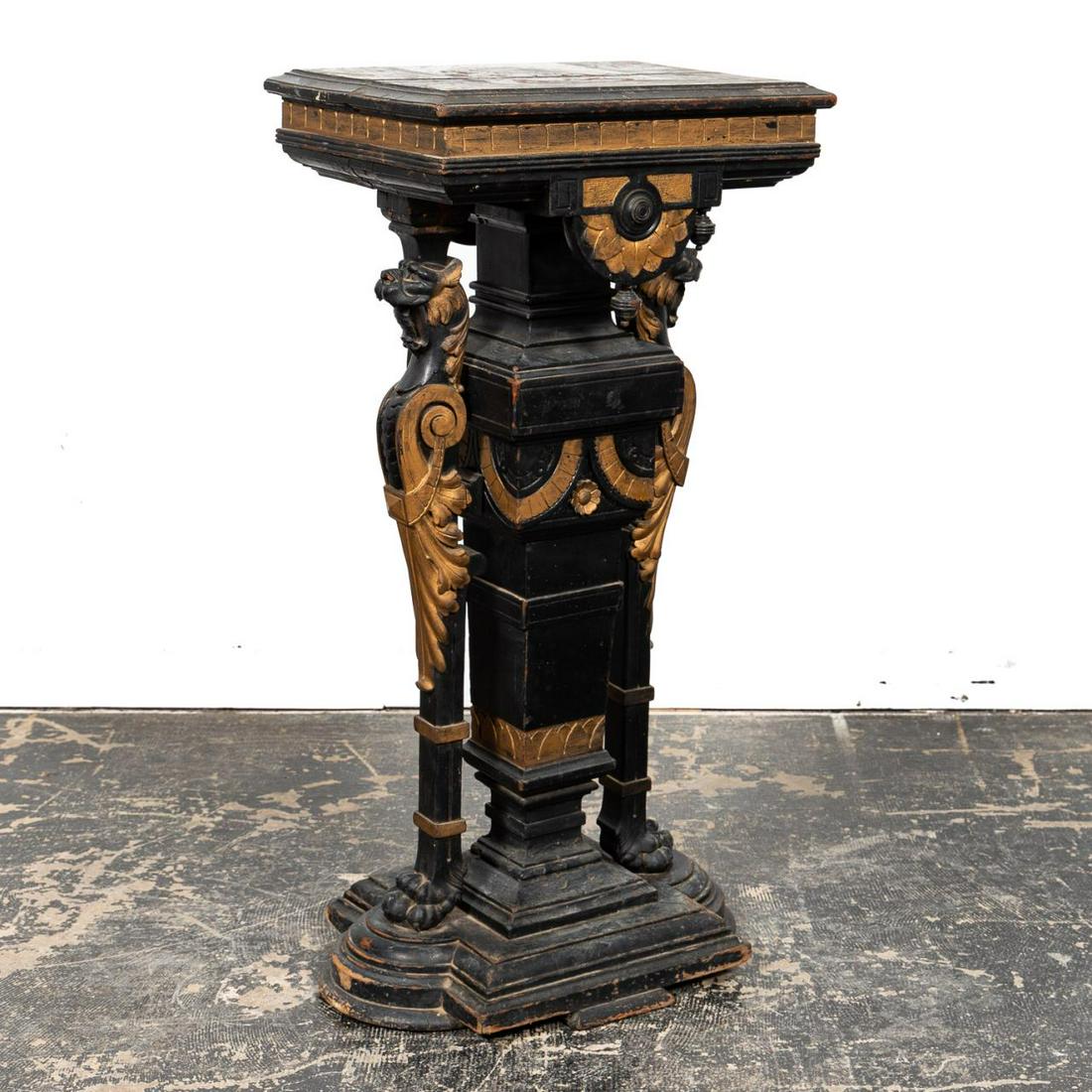 19TH C. RENAISSANCE REVIVAL EBONIZED PEDESTAL: American, circa 1880. Possibly Gustave Herter (German/American, 1830–1898), Victorian era renaissance revival ebonized and partial-gilt pedestal or lamp table having a shaped top supported by lions 