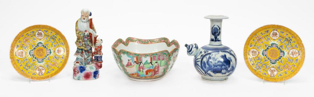 FIVE REPAIRED CHINESE PORCELAIN TABLE ACCESSORIES: Chinese. A group of five porcelain table top accessories comprising of a Rose Medallion bowl, two famille juane plates, blue and white wine pot, and figural sculpture of an elder on rocks. Qianlong ch